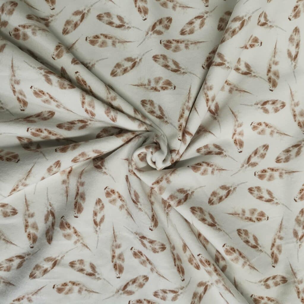 Tissu Jersey Plumes Beiges